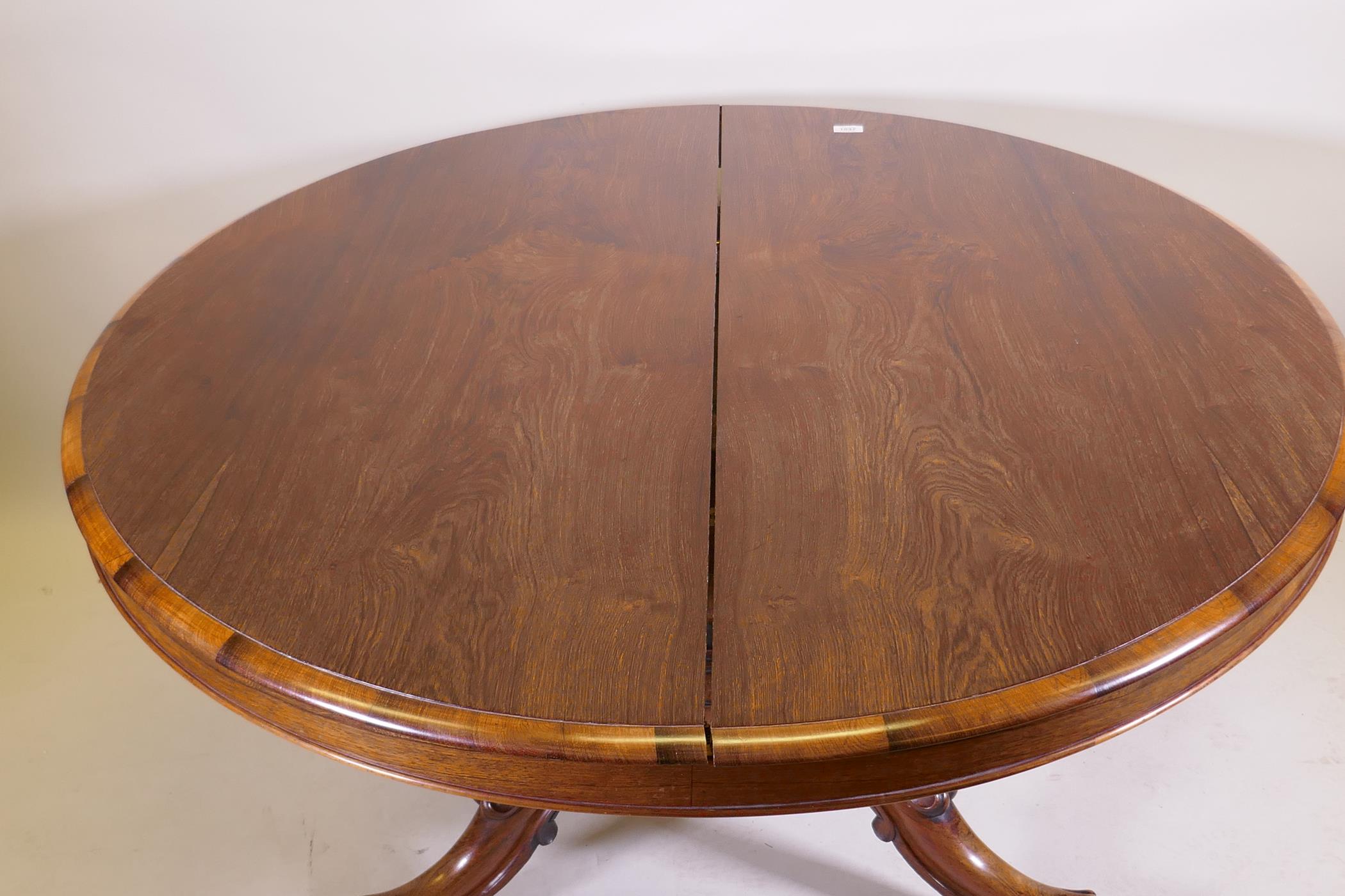 A Victorian rosewood tilt top breakfast table, raised on turned column tripod supports and carved - Image 2 of 7