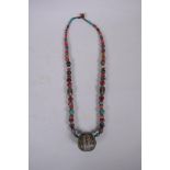 An oriental enamelled white metal, agate, coral, turquoise and multicolour glass bead necklace, 62cm