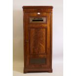 A Victorian figured mahogany letter box, the single door with a brass letter slot and fielded panel,