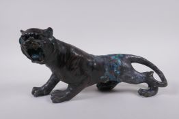 An oriental filled bronzed figure of a tiger, 30cm long