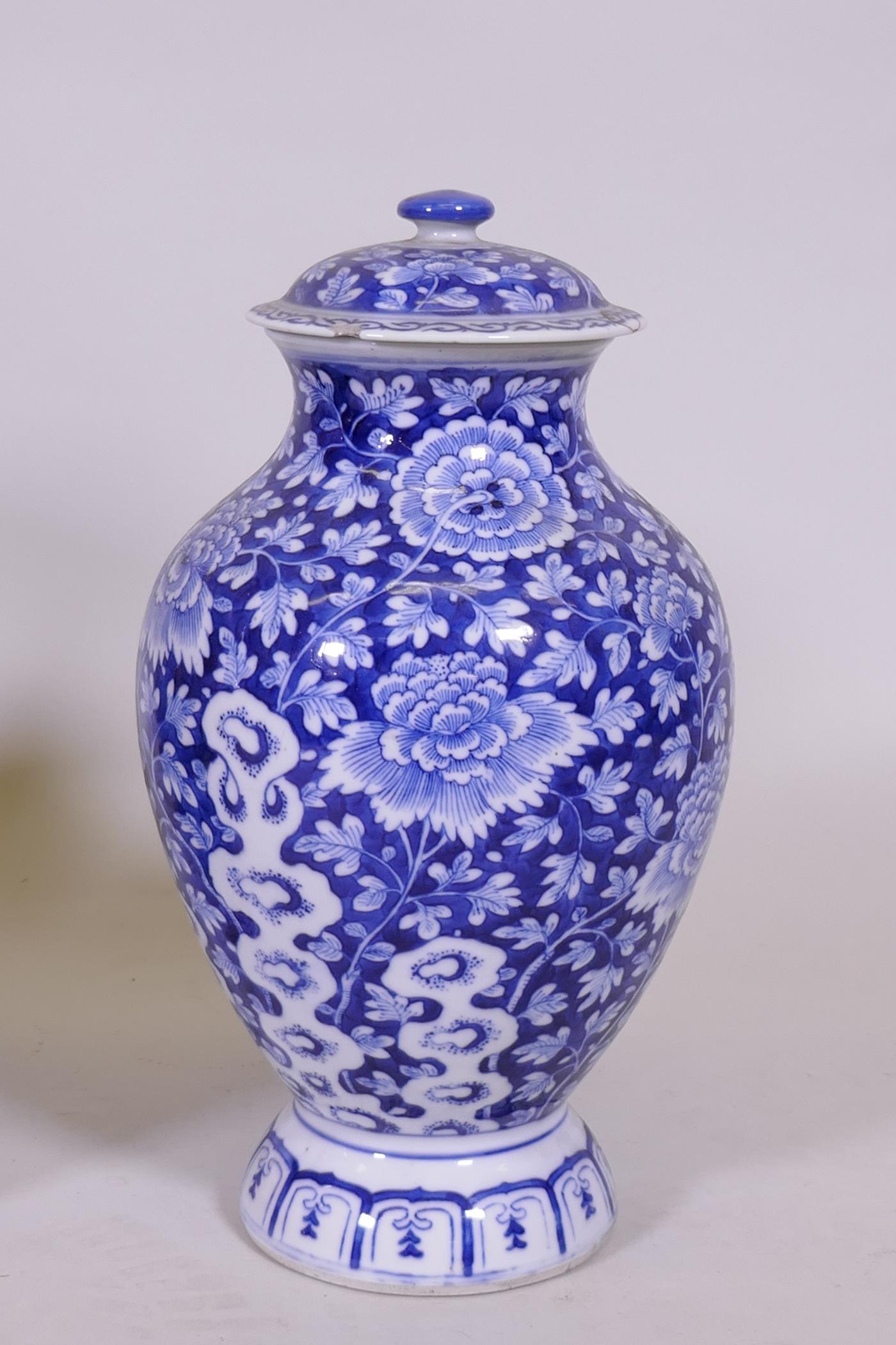 An oriental blue and white jar and cover, 30cm high, a famille noir vase with floral decoration - Image 2 of 7