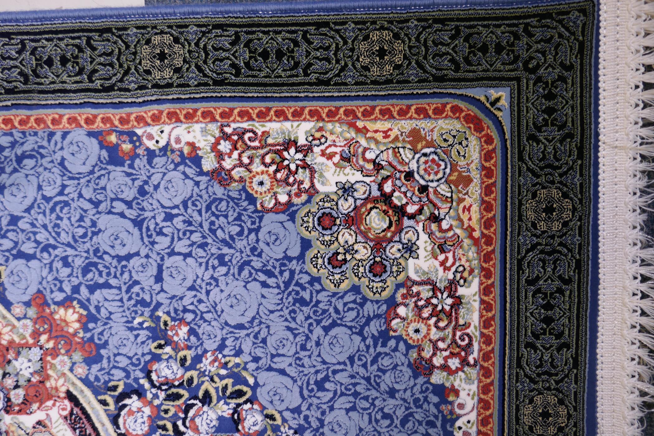 An Iranian fine woven blue ground runner with a medallion design surrounded by an embossed all - Image 4 of 5