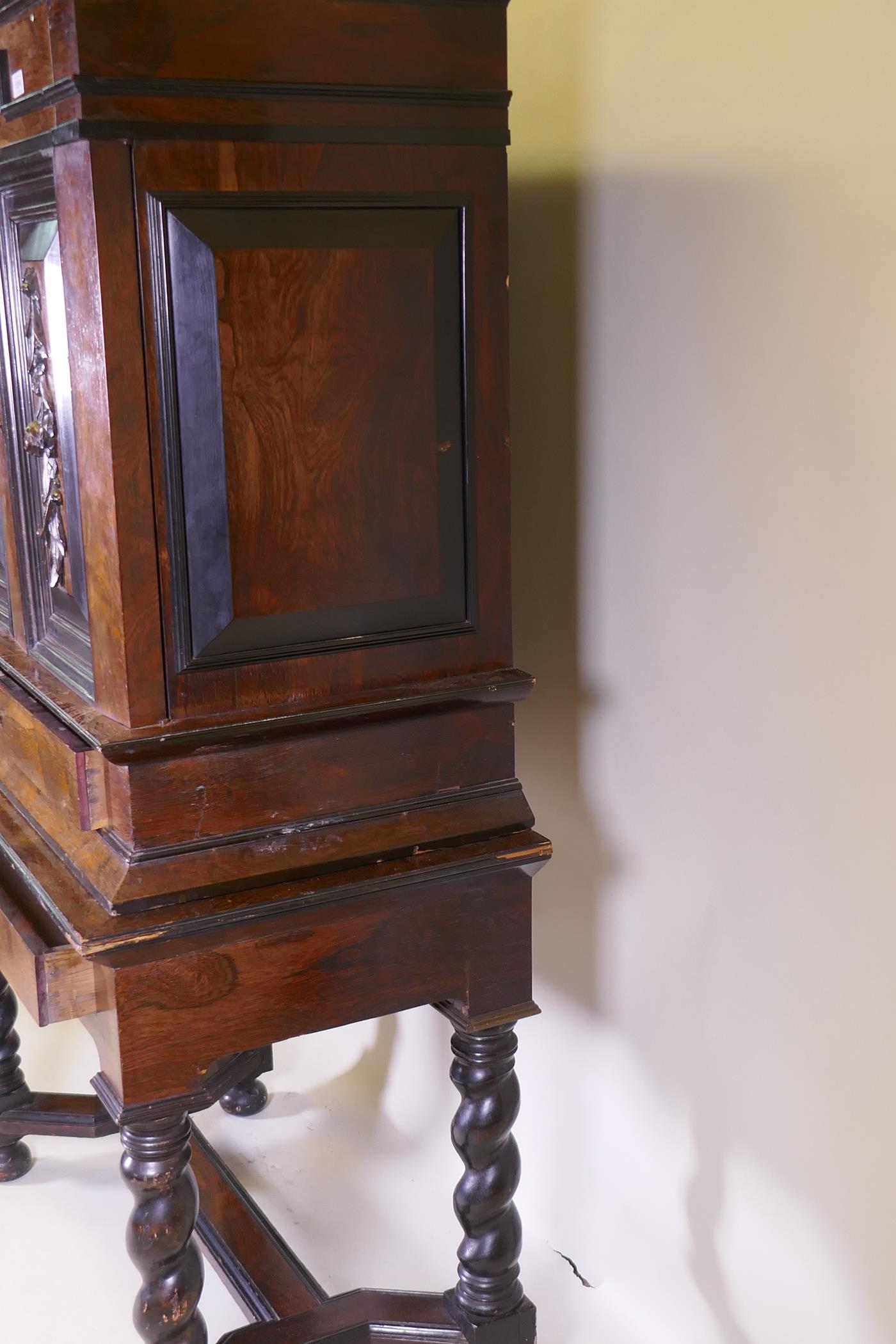 A C19th Continental rosewood cabinet on stand, with carved and ebonised detail, the upper section - Image 7 of 8