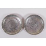 A pair of Chinese white metal coin dishes with zodiac animal decoration