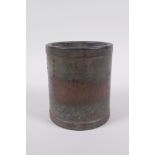 A Chinese bronze brush pot with Lohan and character decoration, impressed mark to base, 11cm high,