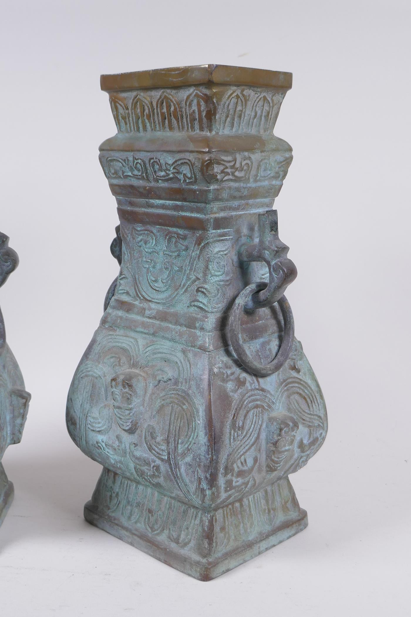 A pair of Chinese archaic style bronze vases with two dragon loop handles, lack bases, 32 cm high - Image 3 of 4