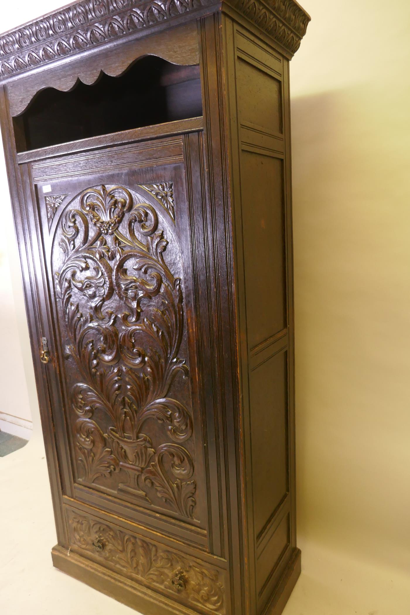 A C19th oak hall cupboard with single door over a drawer and carved decoration in the Renaissance - Image 3 of 6