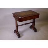 A Georgian mahogany writing table with two end drawers and tooled leather inset top, raised on