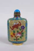 A Chinese cloisonne snuff bottle decorated with a bat, peach and pomegranate, 9cm high