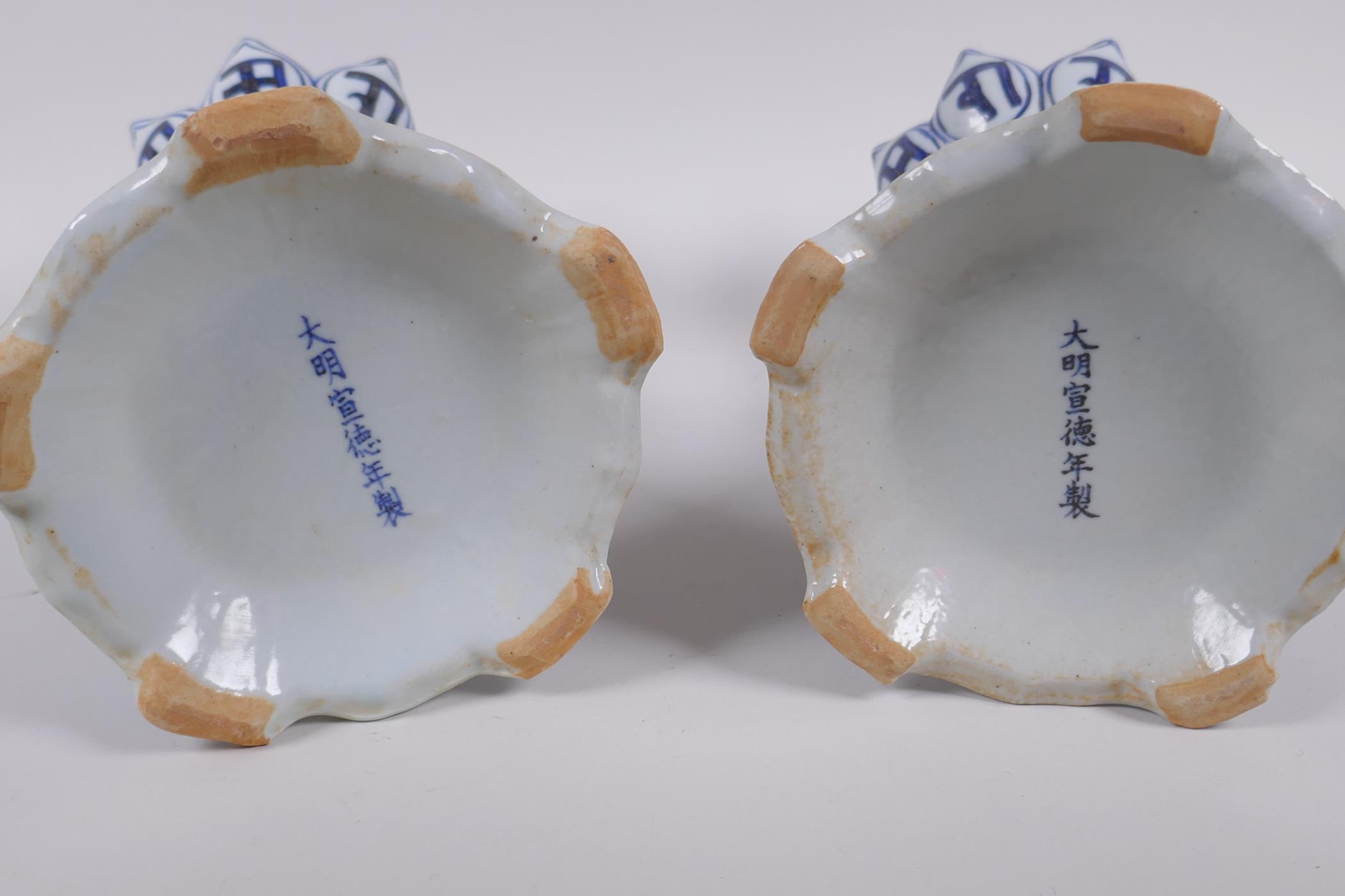 A pair of Chinese blue and white porcelain candlesticks of lotus flower form, with two handles and - Image 7 of 8