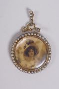 A Victorian 9ct gold mourning pendant set with seed pearls, 5cm drop, 3cm diameter