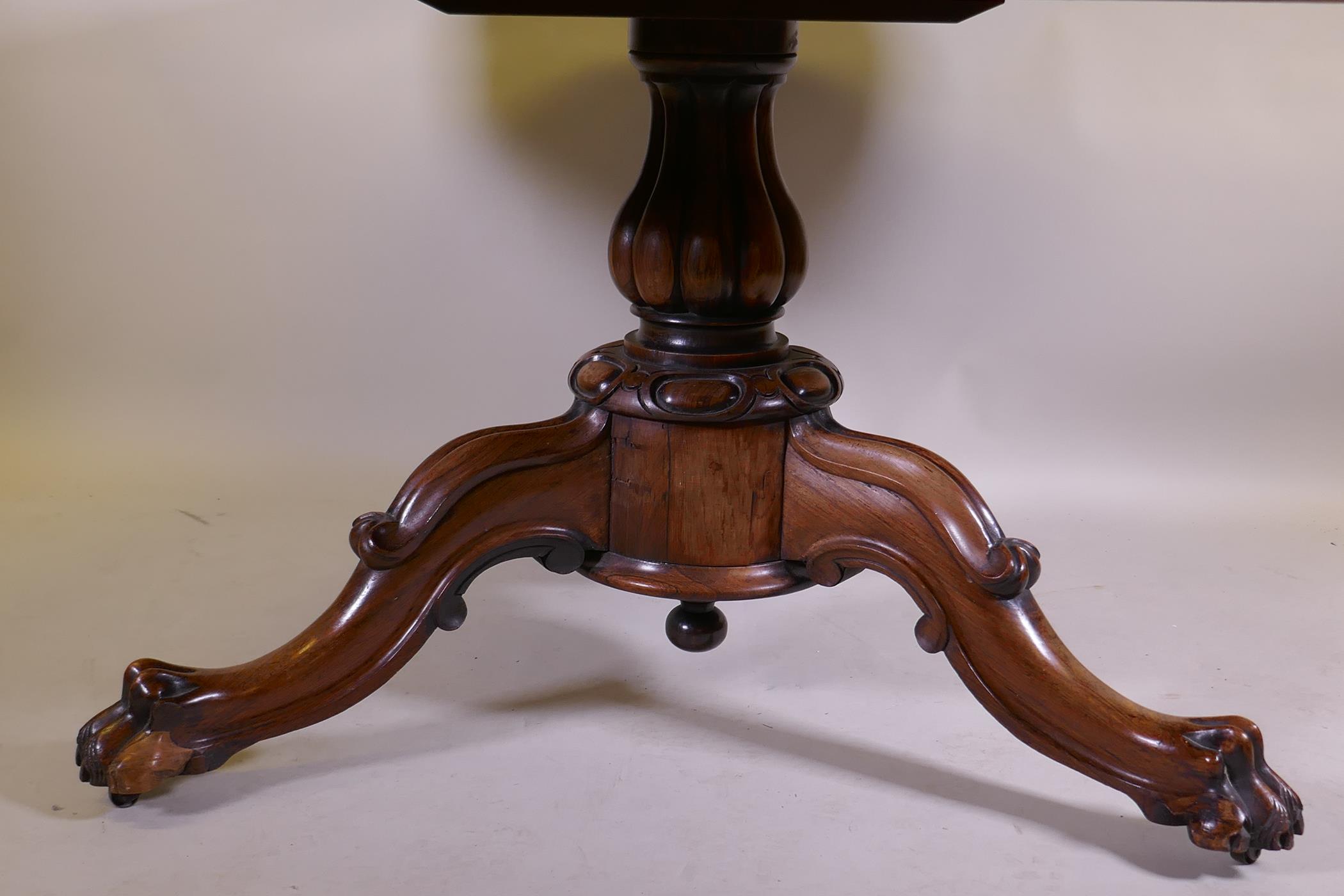 A Victorian rosewood tilt top breakfast table, raised on turned column tripod supports and carved - Image 3 of 7