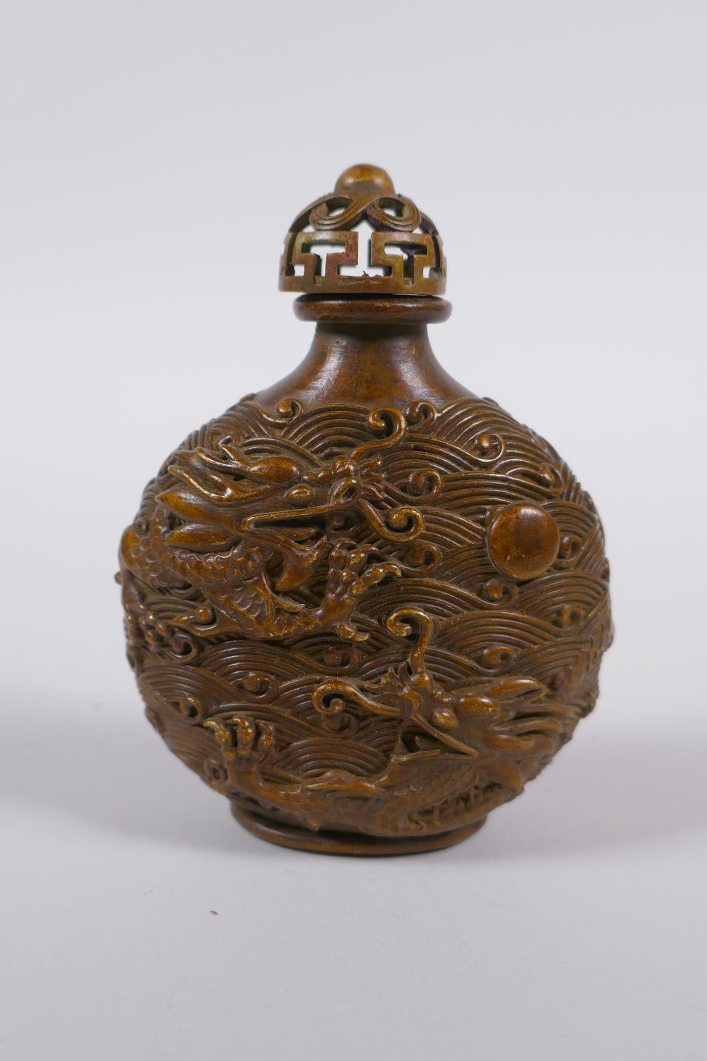A Chinese bronze snuff bottle with raised dragon decoration, impressed 4 character mark to base, 8cm - Image 3 of 4