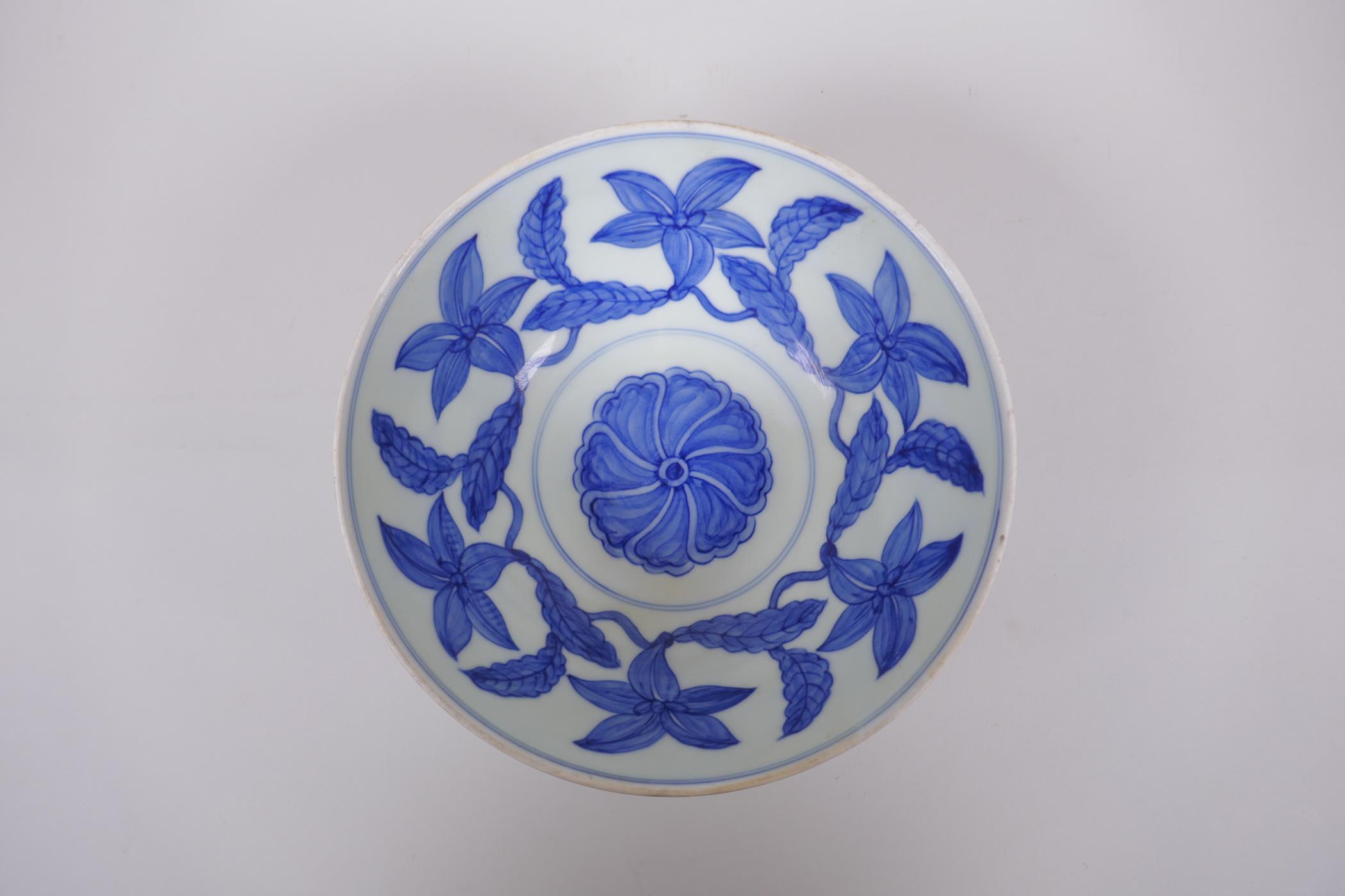 A blue and white porcelain bowl decorated with inter linked flowers, Chinese Chenghua 6 character - Image 2 of 4