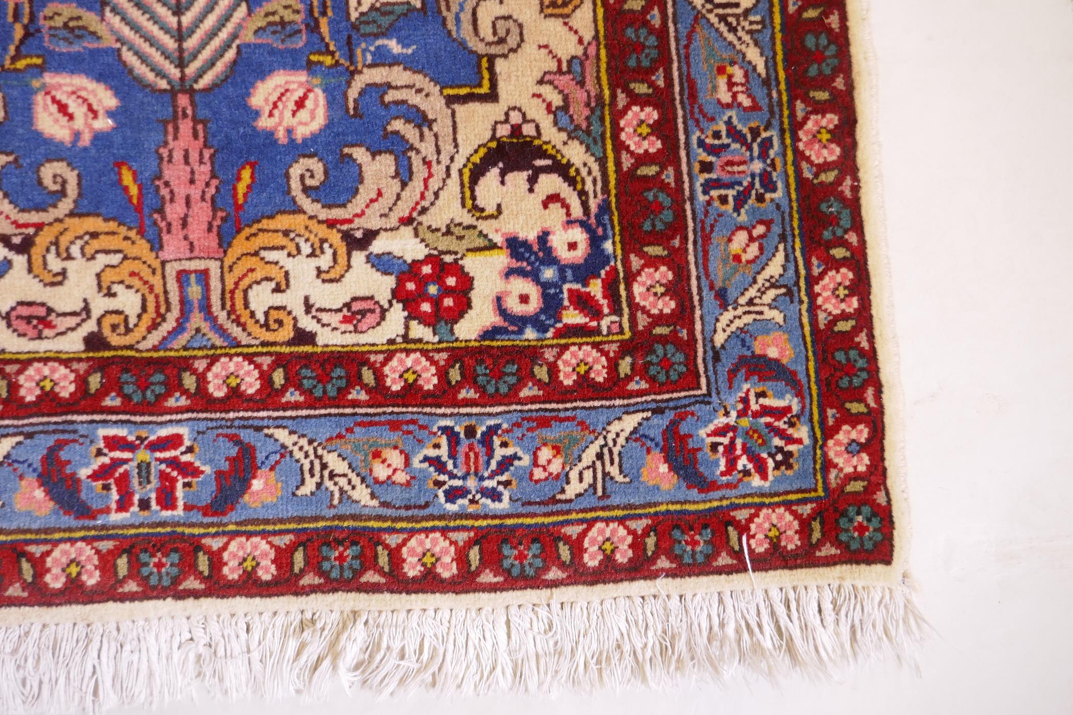 An Iranian cream ground wool rug with blue and red panelled design, 112 x 156cm - Image 3 of 5