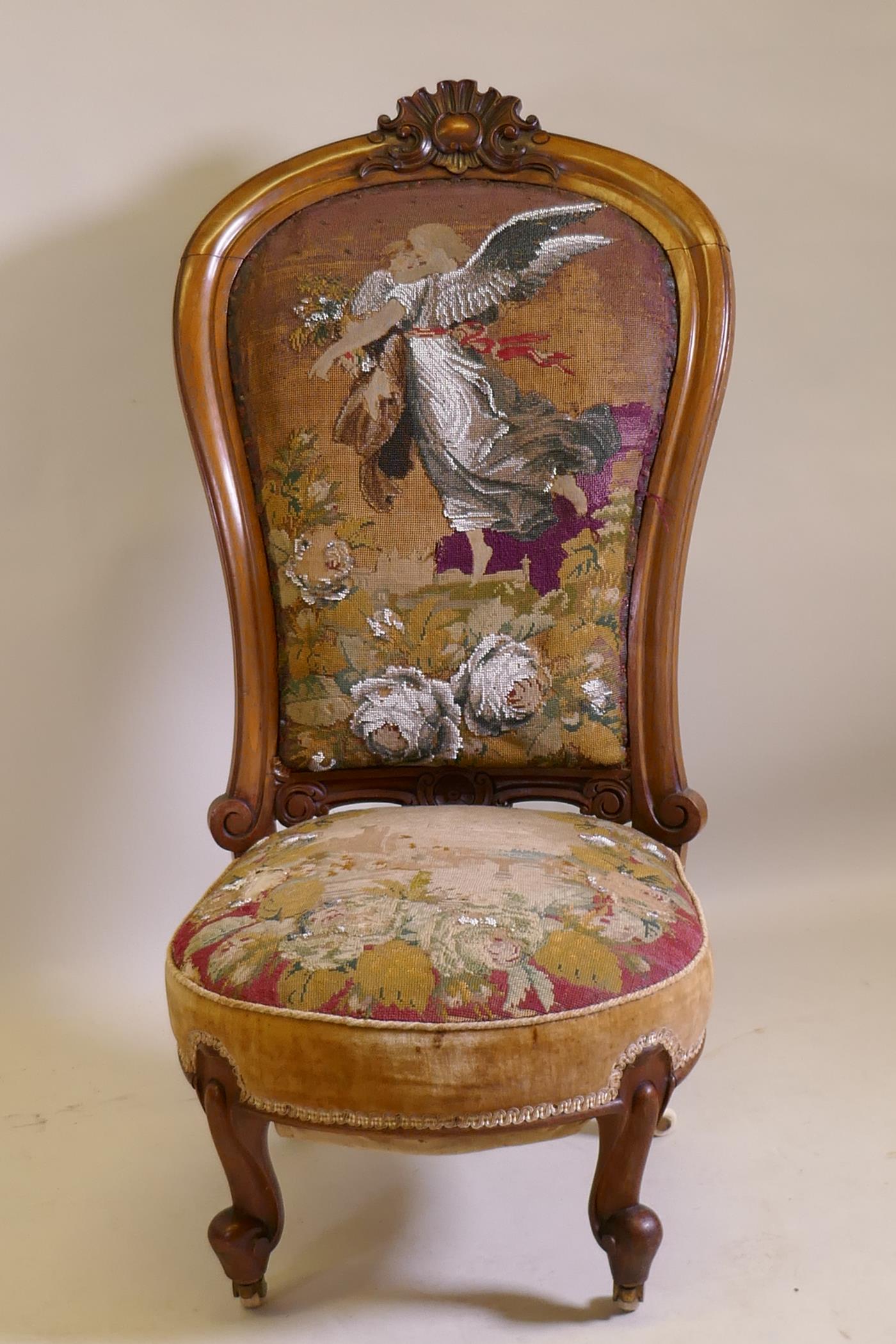 A Victorian walnut nursing chair with carved crest and shaped back, beadwork upholstery, raised on - Image 2 of 3