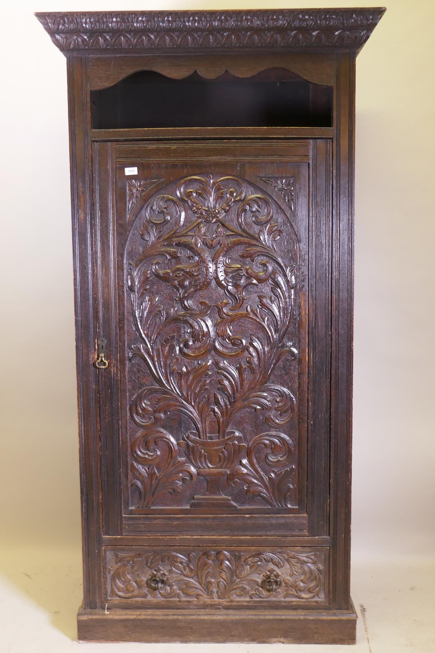 A C19th oak hall cupboard with single door over a drawer and carved decoration in the Renaissance - Image 2 of 6