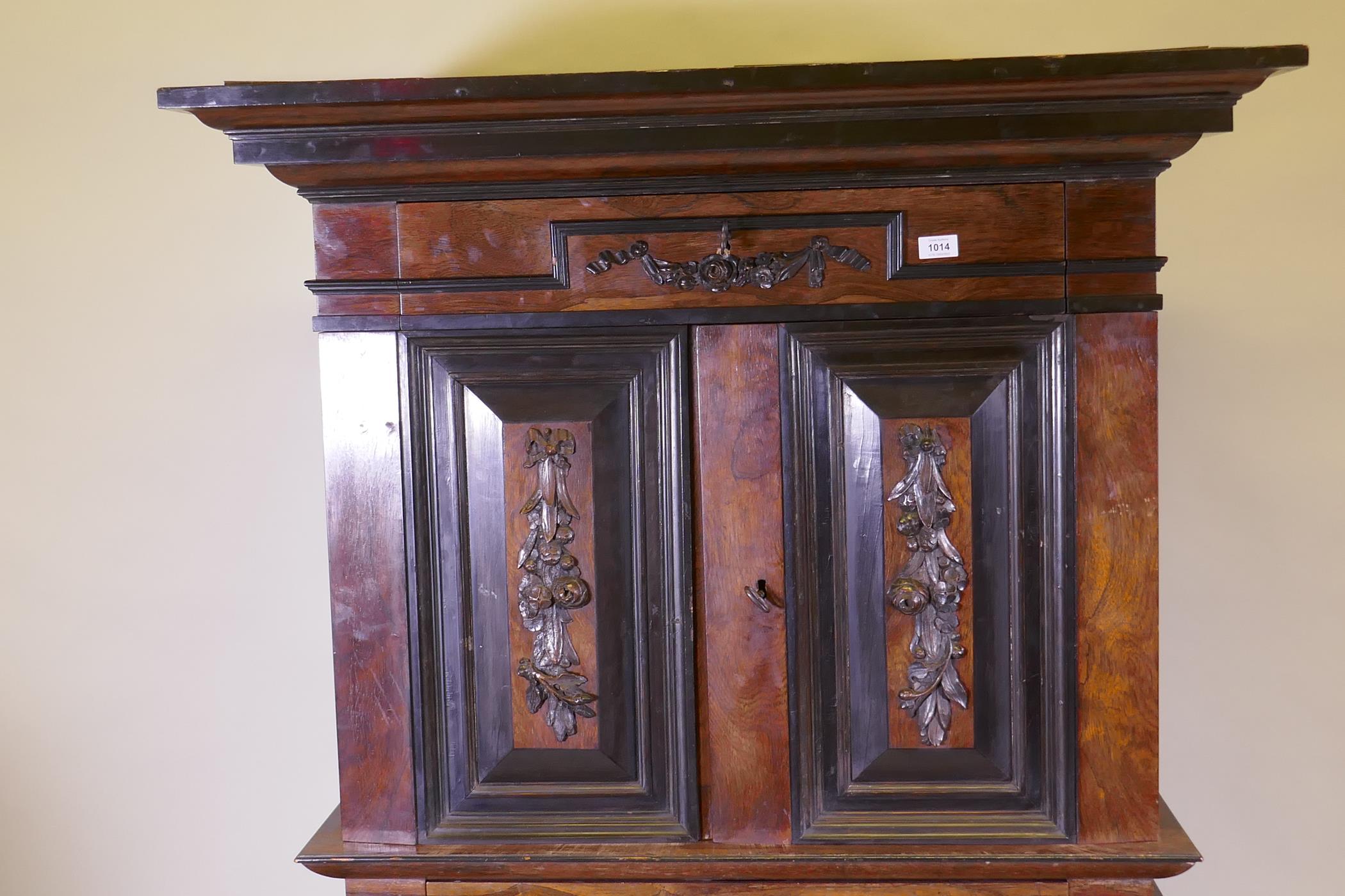 A C19th Continental rosewood cabinet on stand, with carved and ebonised detail, the upper section - Image 2 of 8