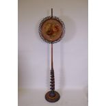 A C19th mahogany barley twist pole screen with embroidered panel, 162cm high