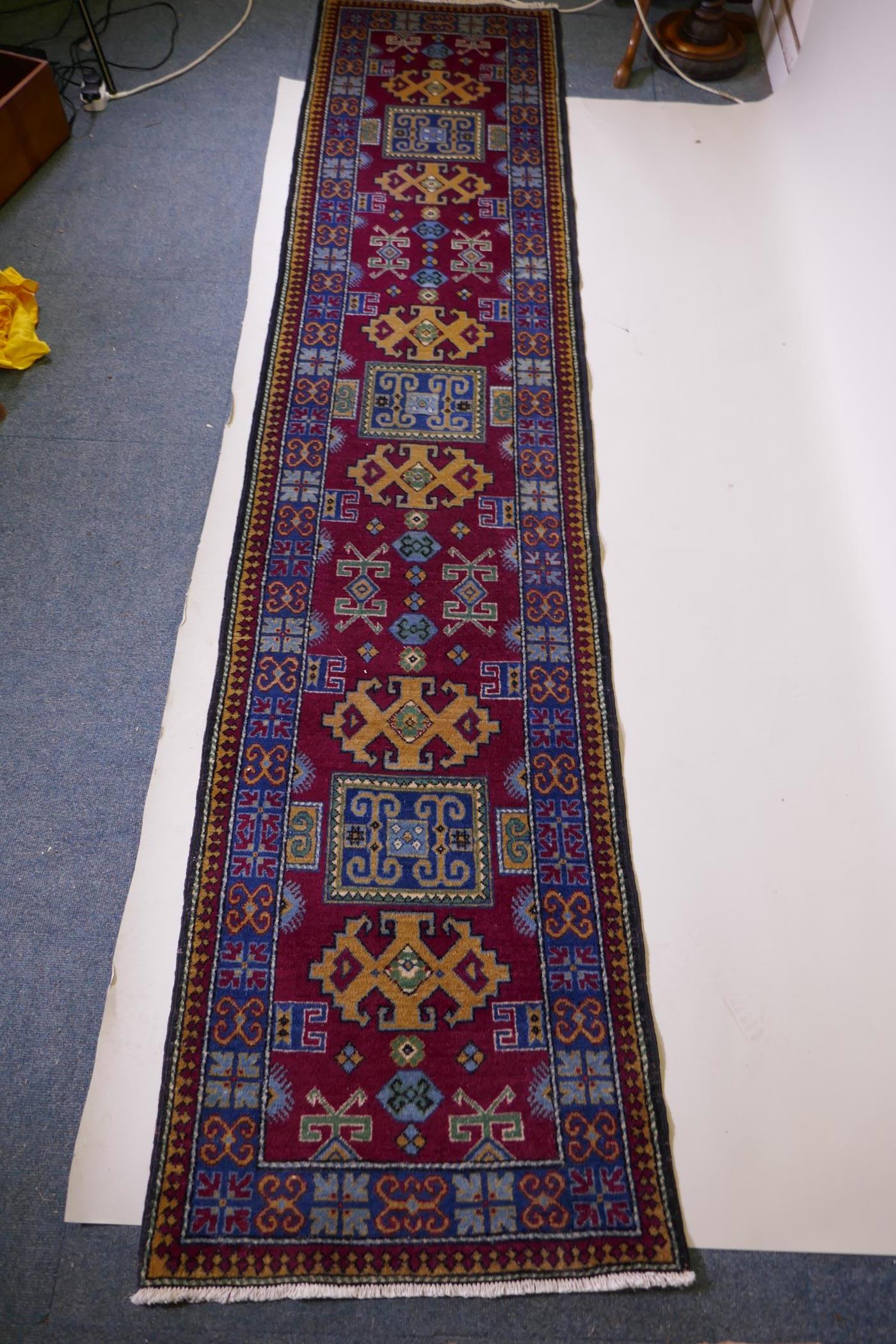 A claret wine ground wool caucasian runner with bespoke medallion design in unique colours, 322 x - Image 3 of 6