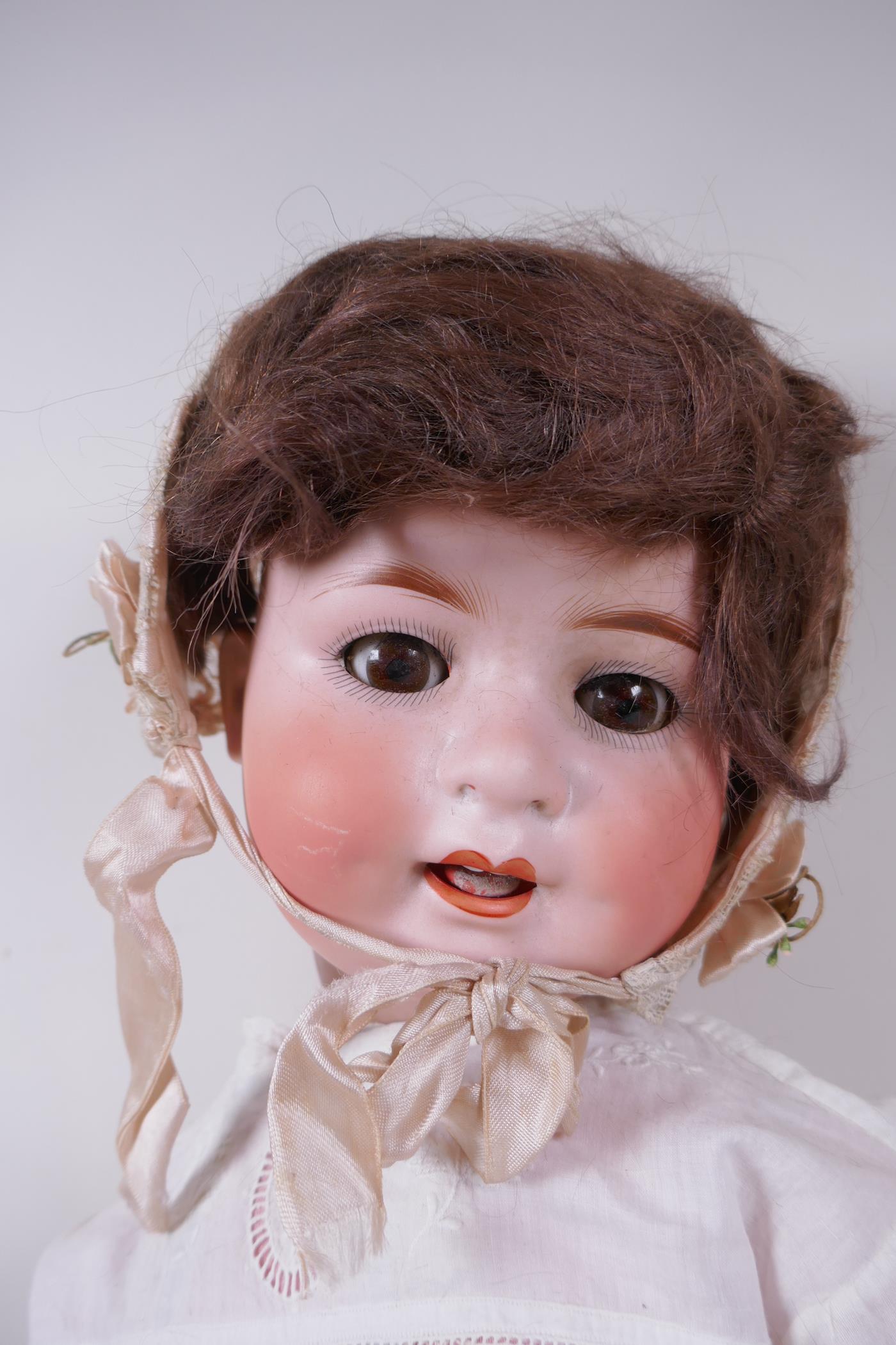 An antique German Heubach Koppelsdorf bisque headed toddler doll with brown sleeping eyes, moving - Image 2 of 5
