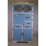 A mid century Stoneham painted kitchen cabinet with glass doors, fall front, three cupboards and