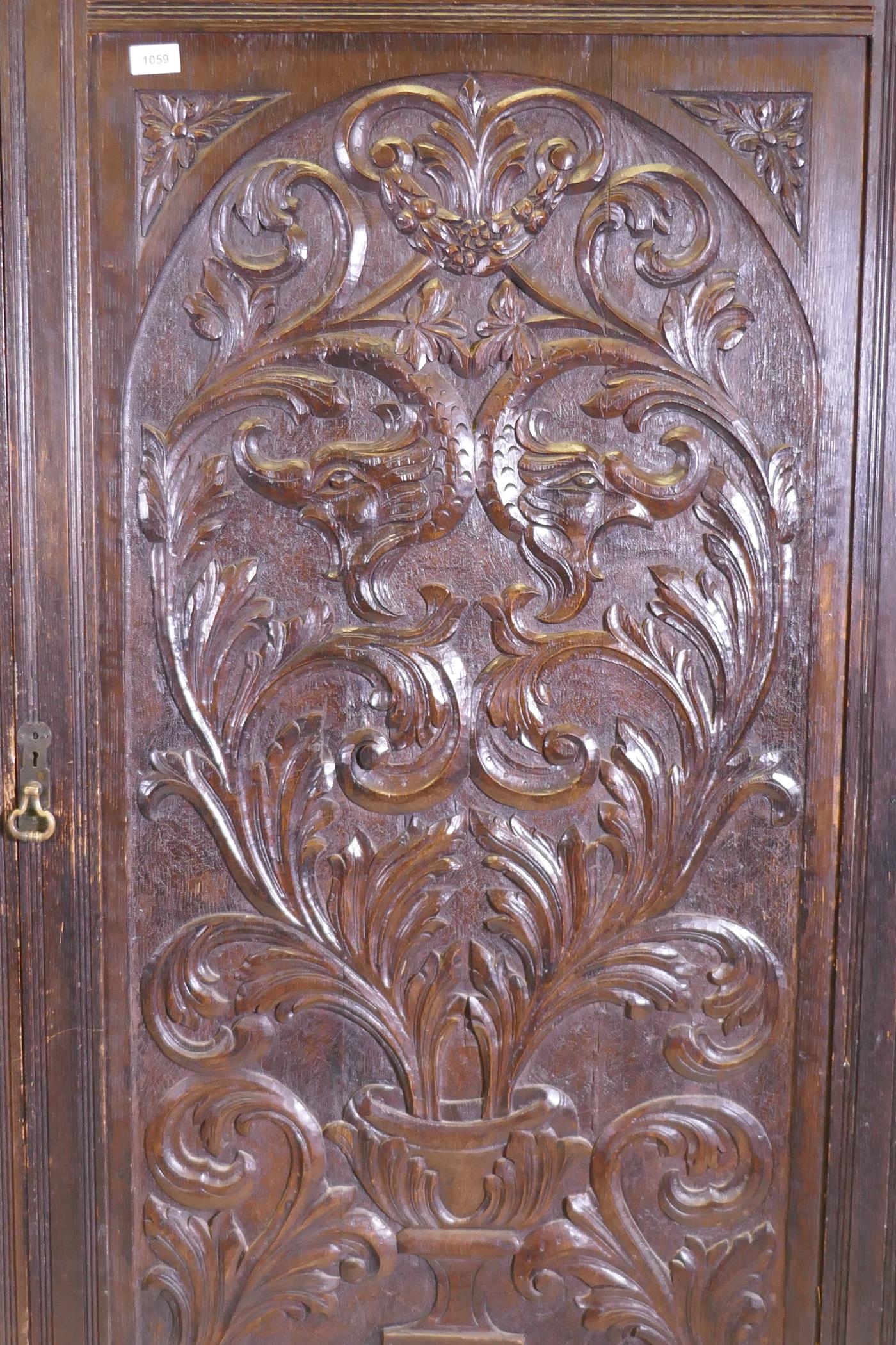 A C19th oak hall cupboard with single door over a drawer and carved decoration in the Renaissance - Image 6 of 6