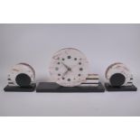 An Art Deco marble clock garniture, largest 37cm wide, 24cm high