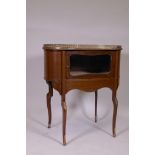 An inlaid mahogany kidney shaped vitrine, with pierced brass gallery top, single glazed door, raised