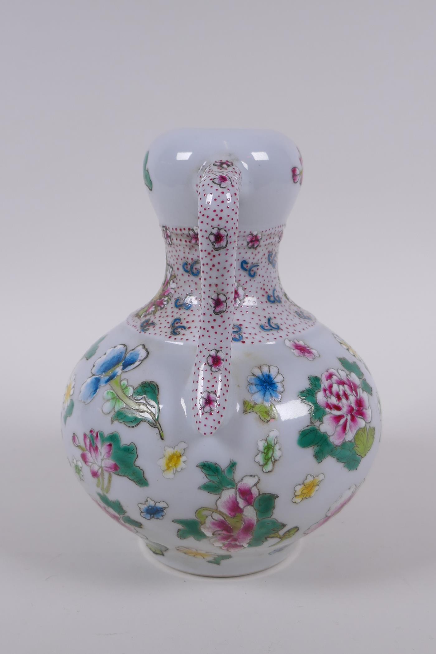 A garlic head shaped porcelain two handled vase, with famille rose enamel floral decoration, Chinese - Image 2 of 6