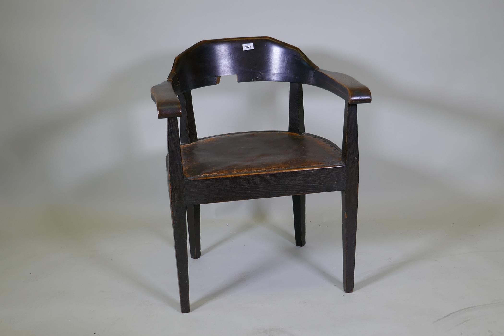 A late C19th/early C20th German oak tub chair with leather studded seat