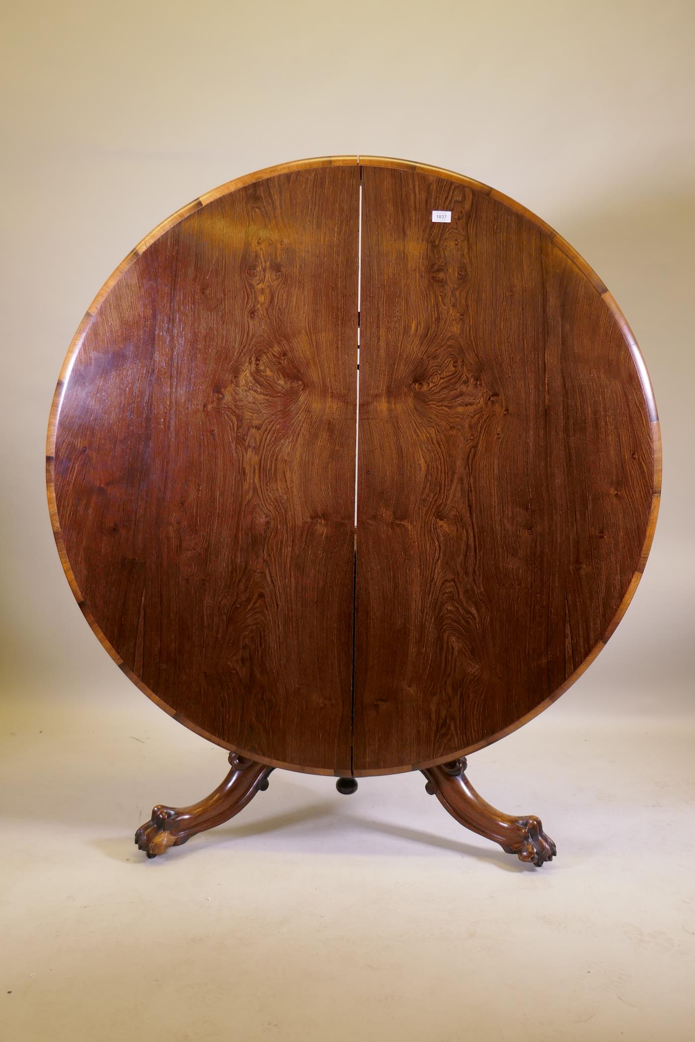 A Victorian rosewood tilt top breakfast table, raised on turned column tripod supports and carved - Image 4 of 7