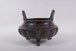 A Chinese silver inlaid bronze censer of lotus flower form, with two handles, landscape decoration