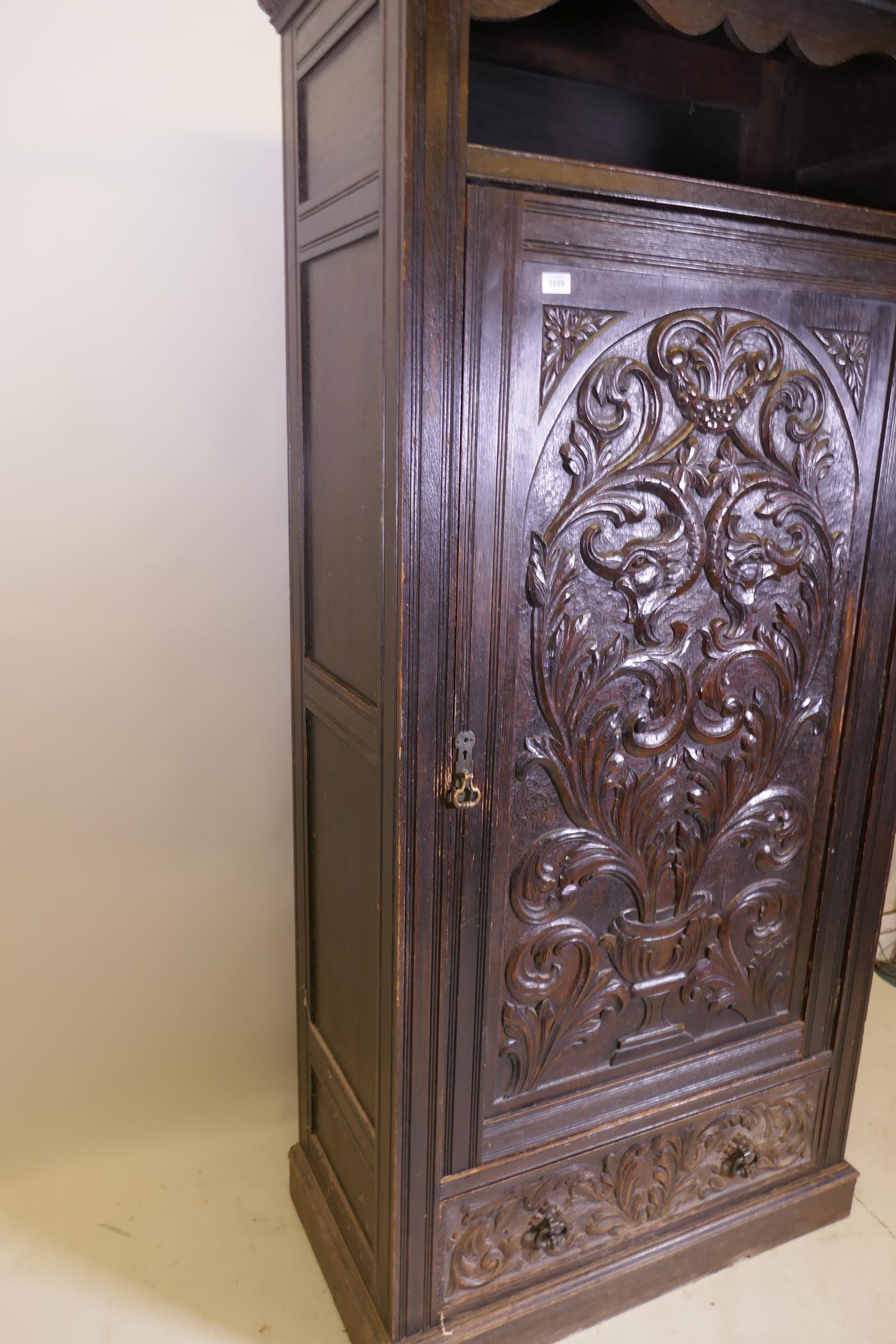 A C19th oak hall cupboard with single door over a drawer and carved decoration in the Renaissance - Image 4 of 6