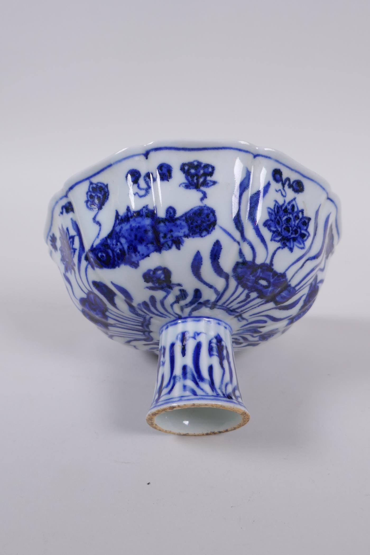 A blue and white porcelain stem bowl of lobed form, decorated with carp in a lotus pond, Chinese - Image 5 of 7