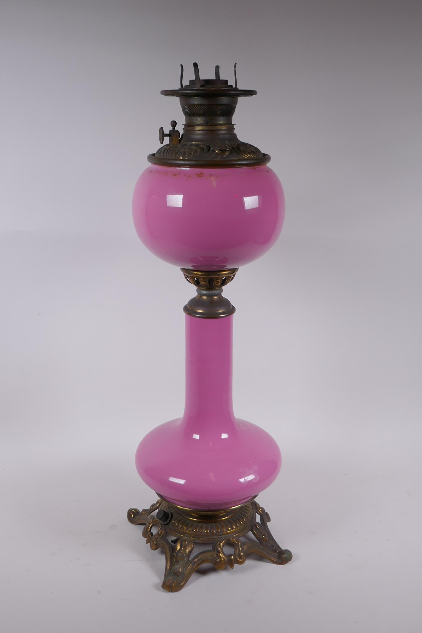 A pink glass and brassed metal oil lamp converted to electricity, 64cm high - Image 4 of 5