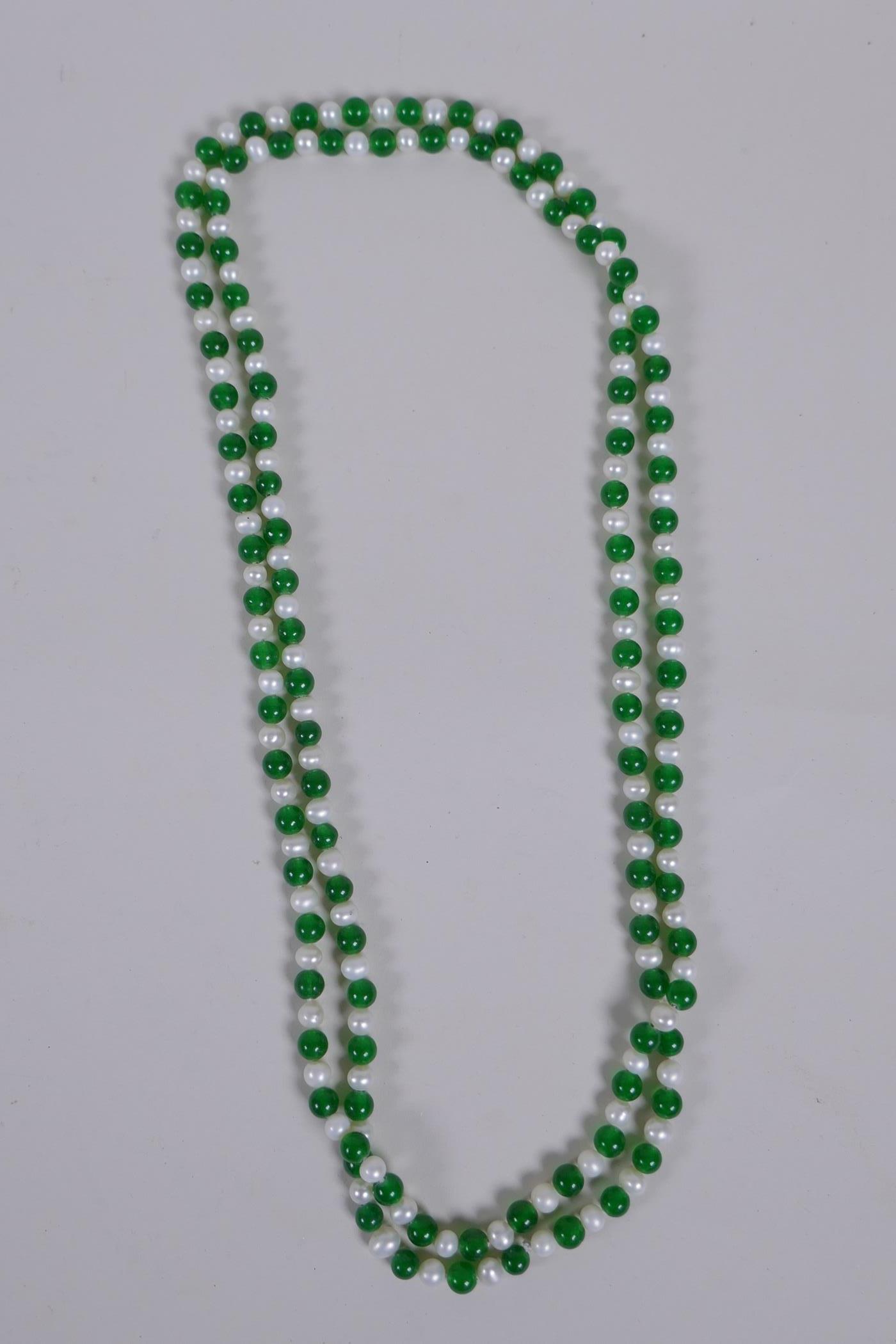 A green jade and pearl bead necklace, 120cm long