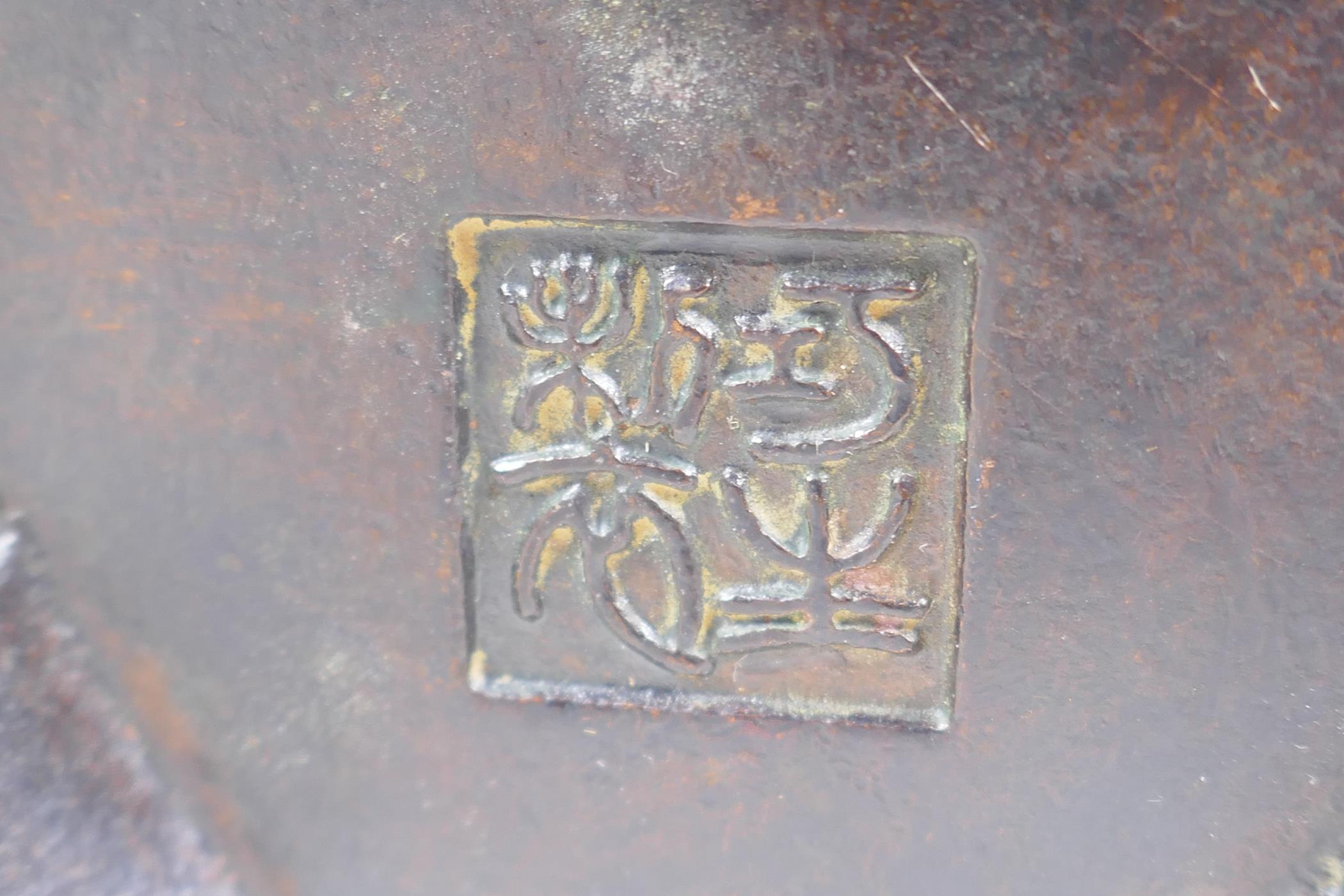 A Chinese bronze censer and cover with a ribbed body and tripod supports, impressed seal mark to - Image 4 of 4