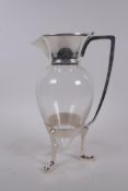 A Christopher Dresser style silver plate and glass claret jug, 26cm high