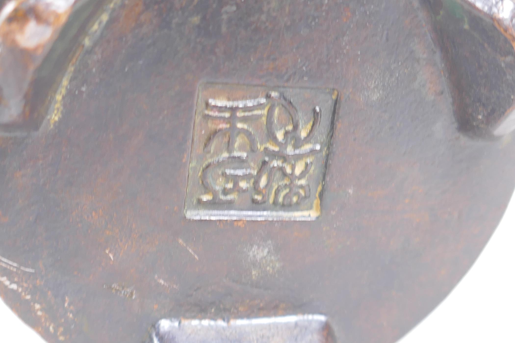 A Chinese bronze censer and cover with a ribbed body and tripod supports, impressed seal mark to - Image 3 of 4