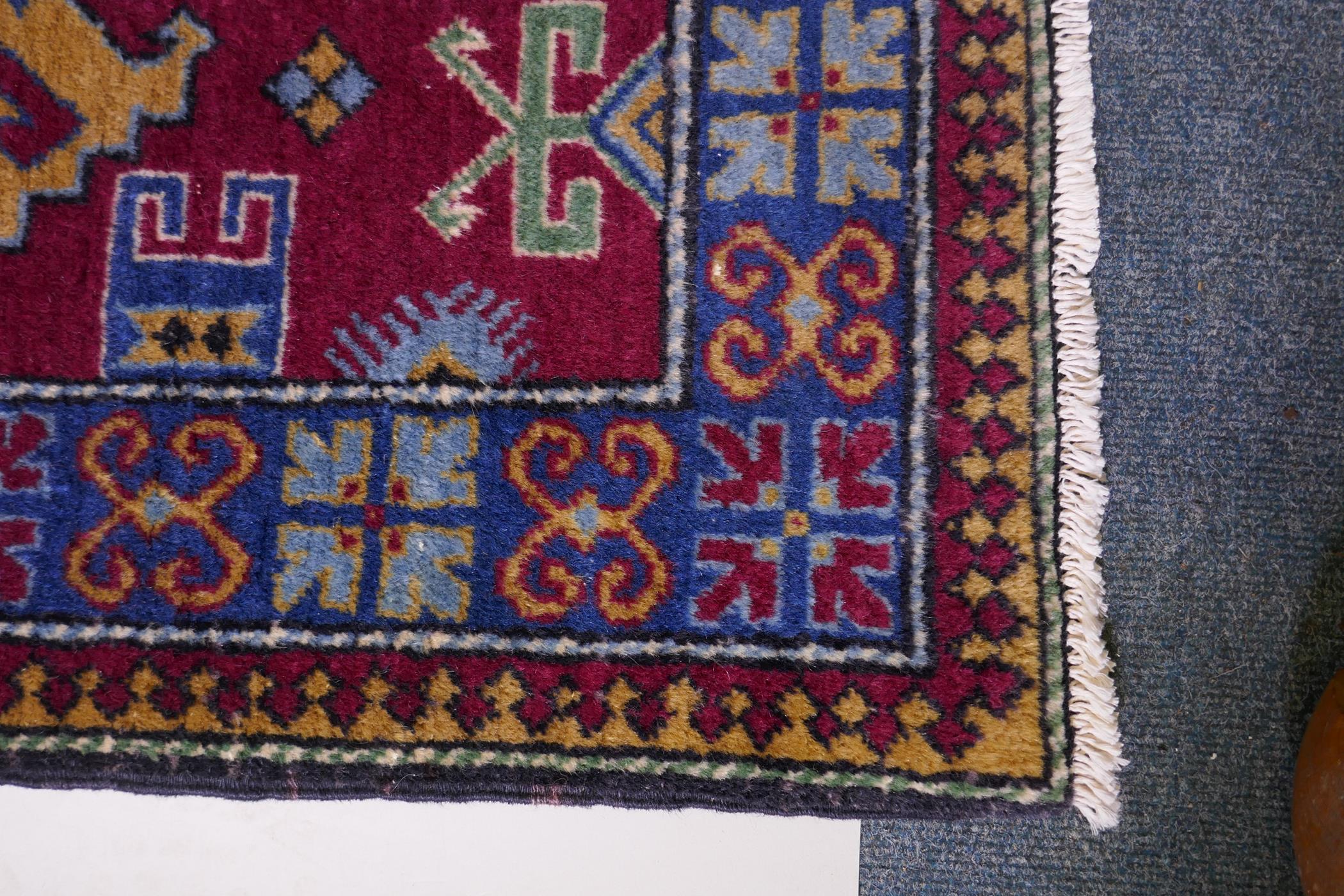 A claret wine ground wool caucasian runner with bespoke medallion design in unique colours, 322 x - Image 5 of 6