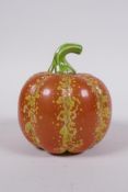 A Chinese polychrome porcelain pumpkin, gold Qianlong seal mark to base, 10cm high, 10cm diameter