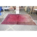 A hand woven wool Bokhara carpet, faded one end, 200 x 300cm