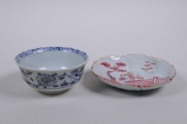 A Chinese Ming style blue and white porcelain tea bowl and red and white porcelain saucer with