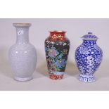 An oriental blue and white jar and cover, 30cm high, a famille noir vase with floral decoration