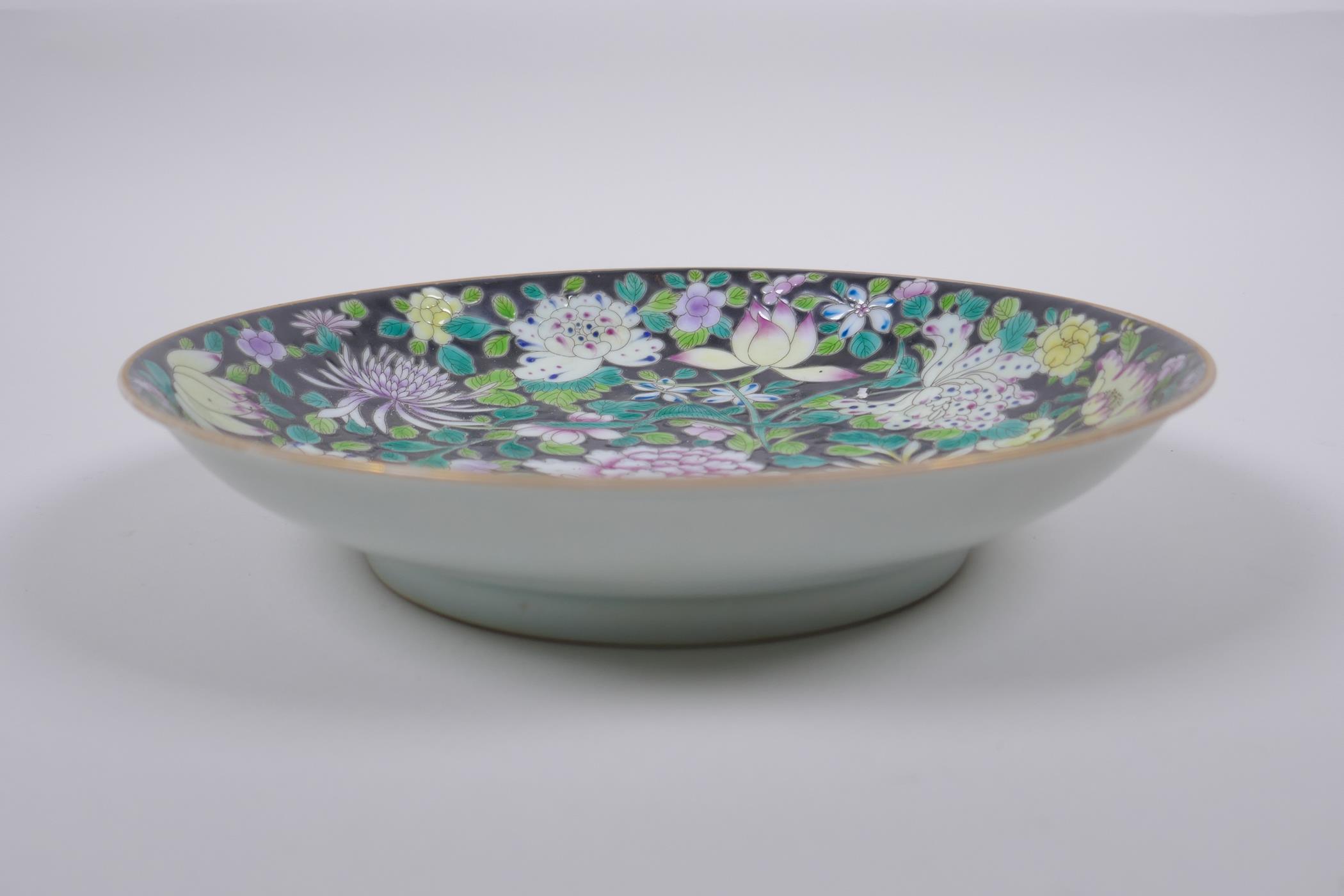 A Chinese famille noir porcelain dish decorated with asiatic flowers, YongZheng 6 character mark - Image 2 of 4