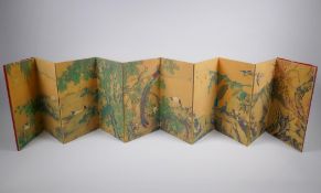 A Chinese printed concertina book depicting an extensive landscape with numerous asiatic birds, 18 x