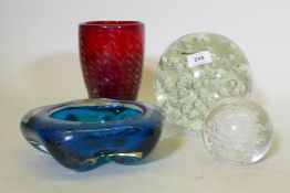 A large glass weight, 19cm high, AF cracked, a studio glass vase and bowl, a smaller weight and Moet
