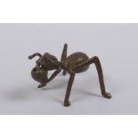 A Japanese style bronze okimono ant incense stick holder, indistinct mark to base, 5cm long