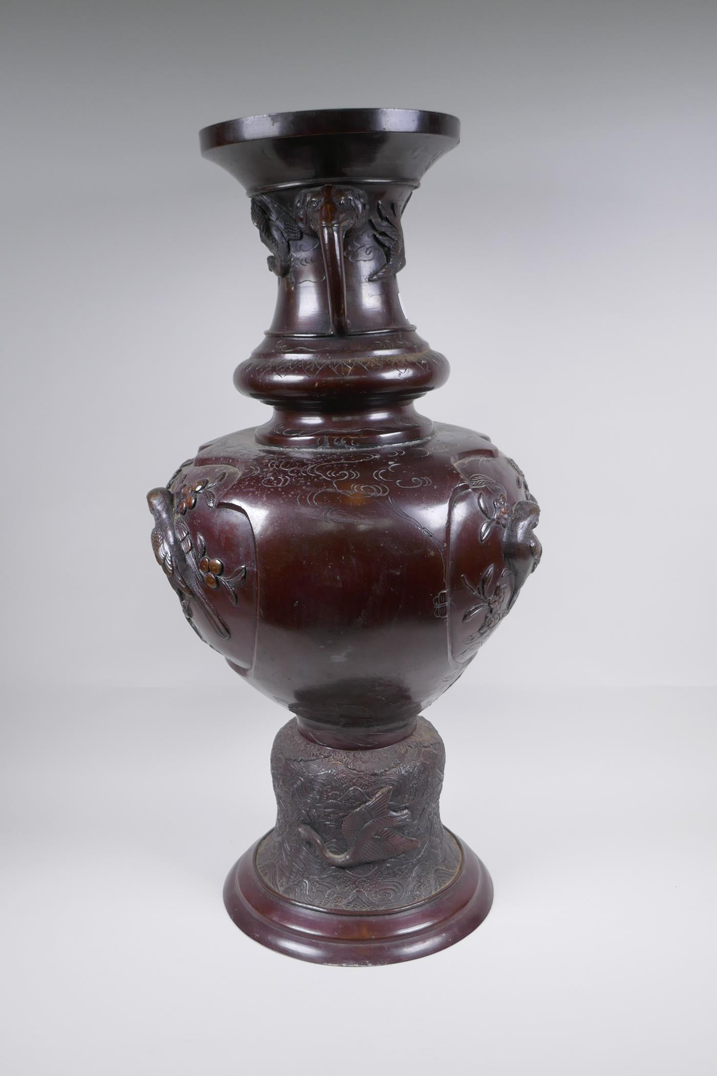 A Japanese Meiji period bronze urn with two handles and raised decorative panels depicting asiatic - Image 4 of 9